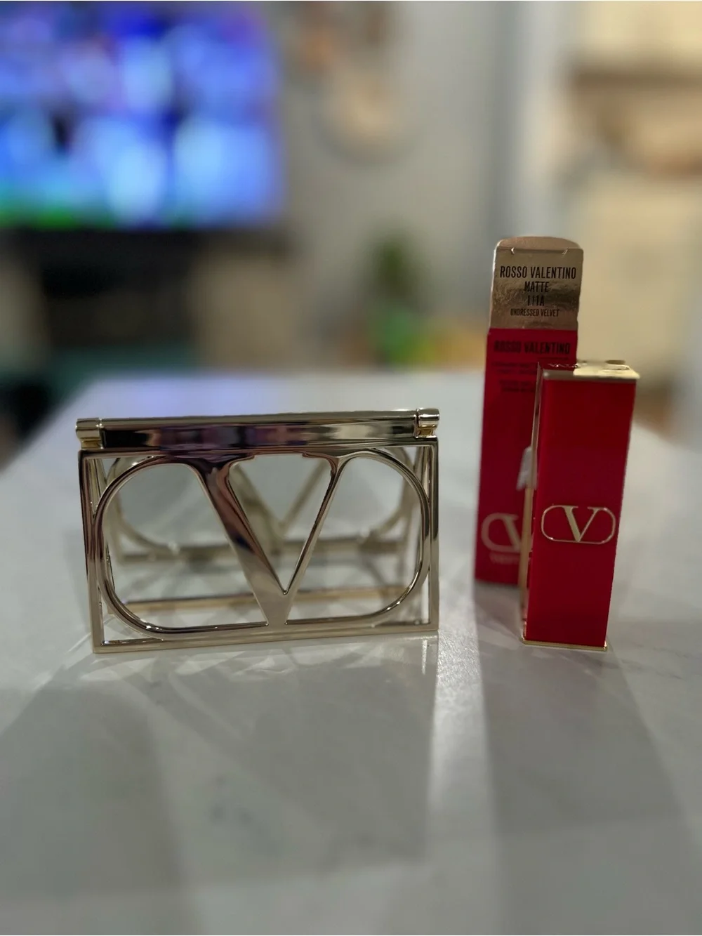 Valentino gold compact mirror with Valentino lipstick